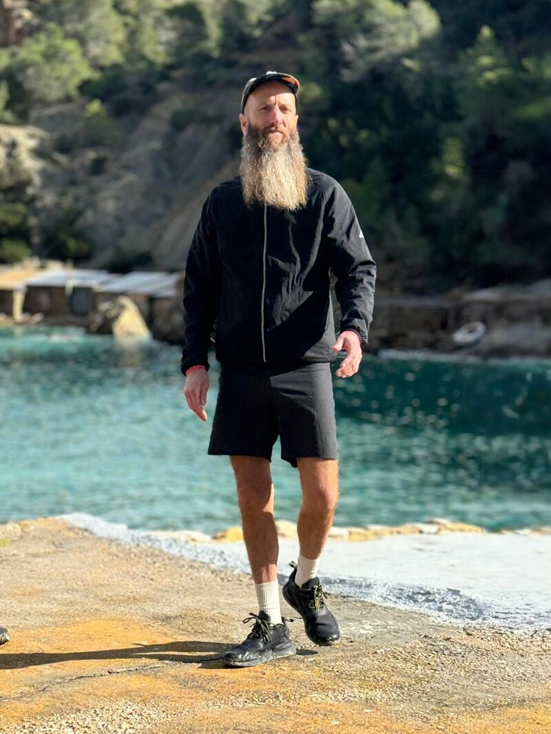 Peter Adams, life coach, standing by the coast in Ibiza